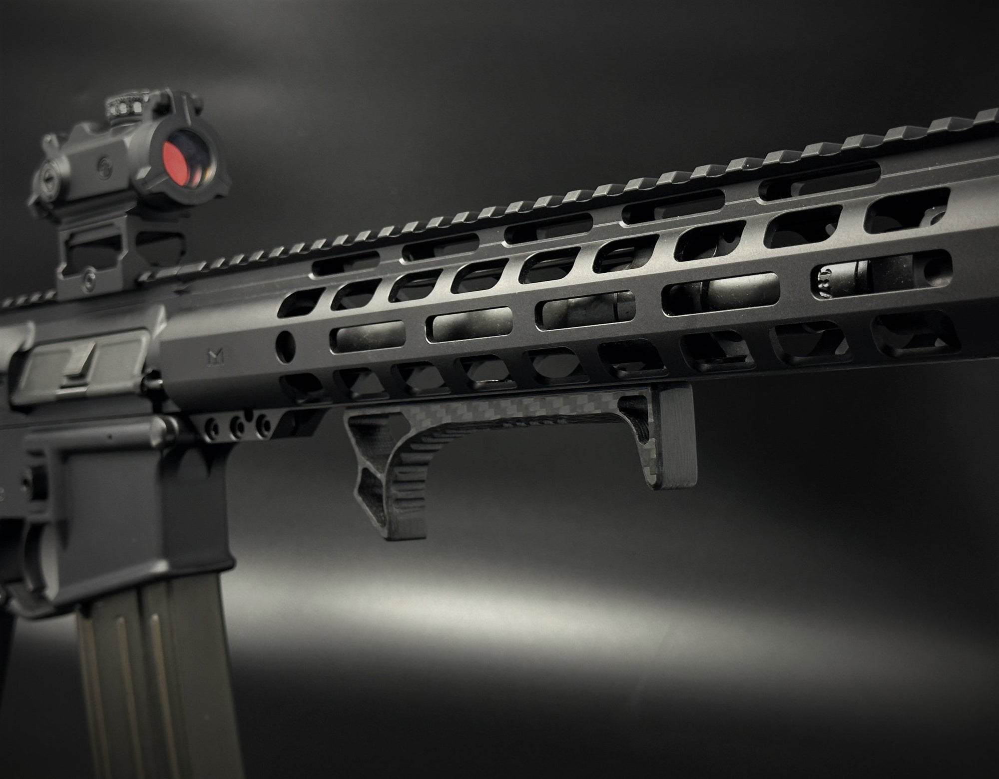 carbon fiber m-lok extended handstop installed on ar handguard angled view 