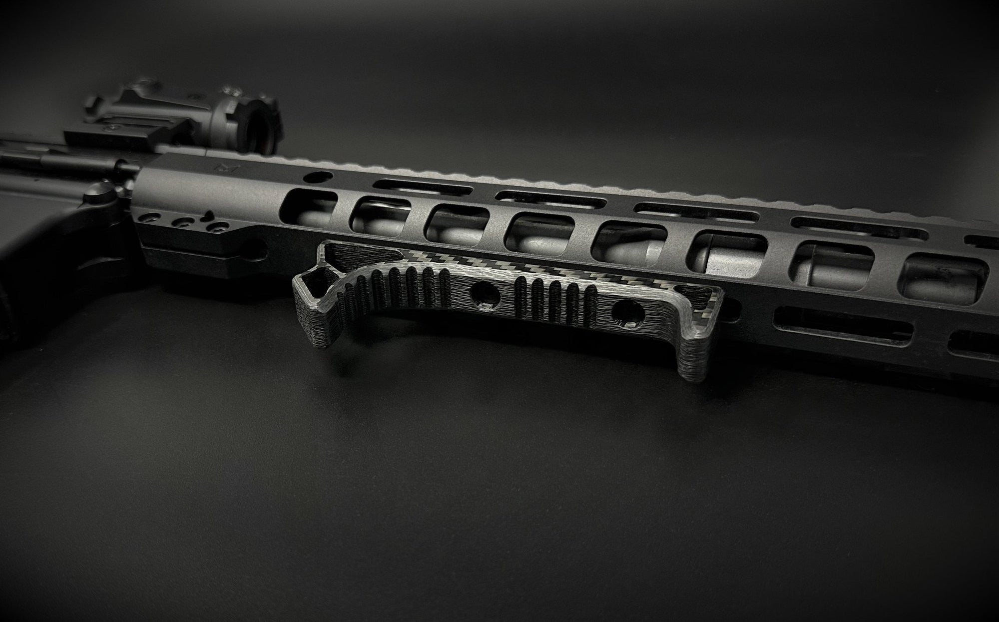 carbon fiber m-lok extended handstop installed on ar handguard